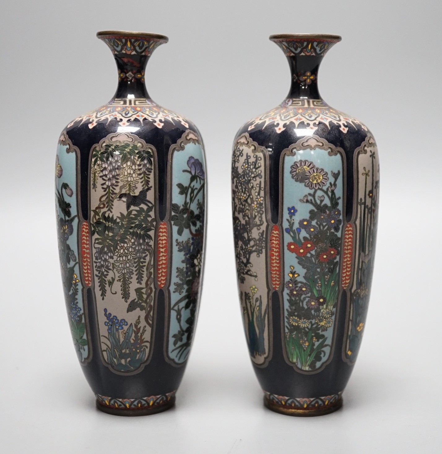 A pair of Meiji period Japanese silver wire cloisonne enamel vases, 15cm tall